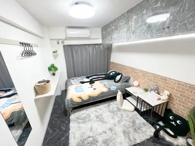 a small room with a bed and a desk at Ikebukuro Sugamo 203 in Tokyo