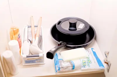 a table with a pot and utensils on it at Mi-APT MIDORI in Tokyo