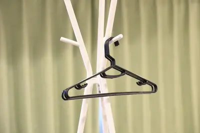 a metal towel rack in front of a curtain at \u30a2\u30f3\u30c9\u30b9\u30c6\u30a4\u3059\u3082\u3046\u30db\u30c6\u30eb402 in Tokyo