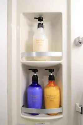 a refrigerator with three bottles of detergents in it at \u30a2\u30f3\u30c9\u30b9\u30c6\u30a4\u3059\u3082\u3046\u30db\u30c6\u30eb402 in Tokyo