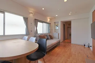 a living room with a bed and a table at V Close to Shinjuku Kabukicho Korean Town FrWIFI E in Tokyo