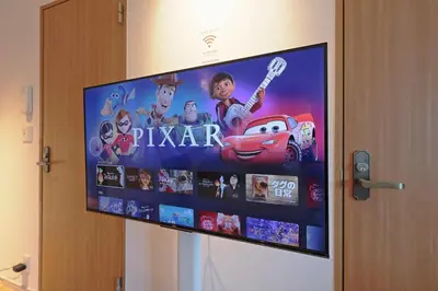 a flat screen tv with a disney movie on it at V Close to Shinjuku Kabukicho Korean Town FrWIFI E in Tokyo