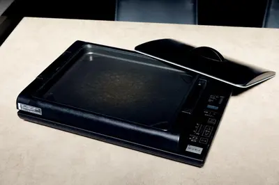 a tablet with a computer mouse on top of it at Luxury stay at Himonya House in Tokyo