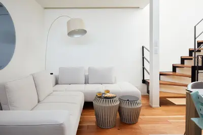 a living room with a white couch and a table at Luxury stay at Himonya House in Tokyo