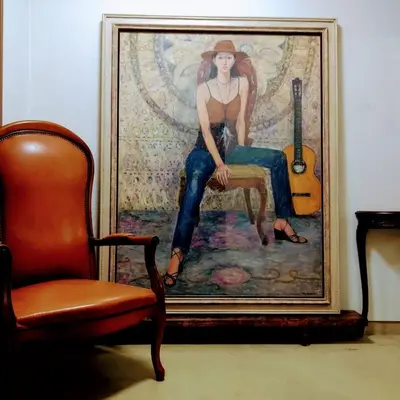 a painting of a woman with a guitar next to a chair at Casa Tokyo -Arakicho- in Tokyo