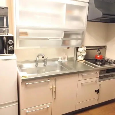 a kitchen with a sink and a stove at Casa Tokyo -Arakicho- in Tokyo