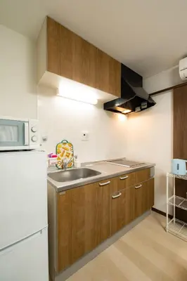 a kitchen with a sink and a refrigerator at 22, Itabashi, Entire house for rent, \u677f\u6a4b in Tokyo
