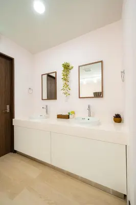 a white bathroom with two sinks and a mirror at 22, Itabashi, Entire house for rent, \u677f\u6a4b in Tokyo