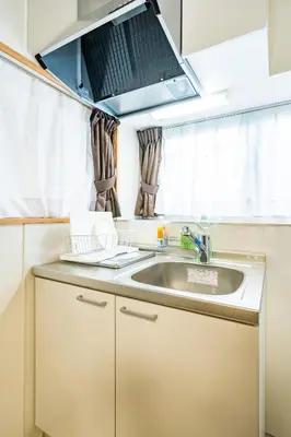 a kitchen with a sink and a microwave at 49, Yotsugi 2, Entire house for rent, \u56db\u3064\u67282 in Tokyo
