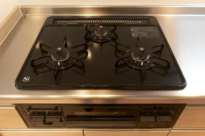 a stove top oven sitting on top of a counter at Frontier Comfort Kitaikebukuro by Tranova in Tokyo