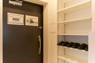 a door leading into a closet with shelves at Frontier Comfort Kitaikebukuro by Tranova in Tokyo