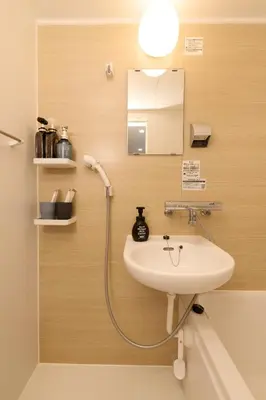 a bathroom with a sink and a mirror at Home Story in Tokyo Ueno&Uguisudani-小島ビル&東京屋語 in Tokyo