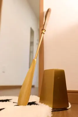 a yellow lamp sitting on top of a table at Home Story in Tokyo Ueno&Uguisudani-小島ビル&東京屋語 in Tokyo