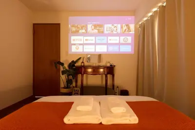 a bedroom with a bed with two towels on it at Home Story in Tokyo Ueno&Uguisudani-小島ビル&東京屋語 in Tokyo