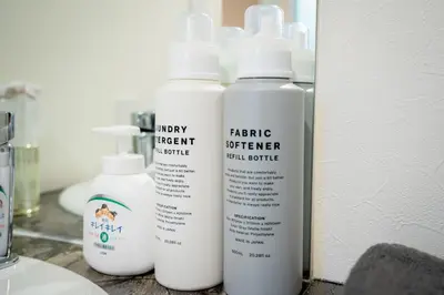 three bottles of cleaning products sitting on a counter at Premier suite Baron Shinjuku West in Tokyo
