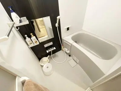 a small bathroom with a tub and a sink at Skytree & Asakusa in front! Newly built 202 in Tokyo