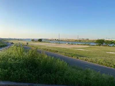 an empty road with a field and a highway at Skytree & Asakusa in front! Newly built 202 in Tokyo