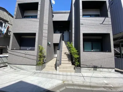 a building with stairs and plants in front of it at Skytree & Asakusa in front! Newly built 202 in Tokyo