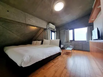 a bedroom with a large bed in a room at PRISM COURT HIRAI Room 801 in Tokyo