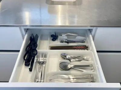 a drawer filled with utensils in a refrigerator at PRISM COURT HIRAI Room 801 in Tokyo