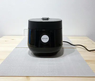 a black router sitting on top of a wooden table at Akariya Asakusa in Tokyo