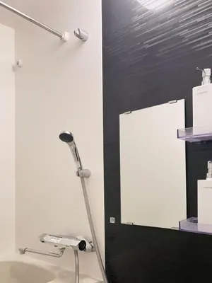 a lamp in a room with a white wall at Akariya Asakusa in Tokyo