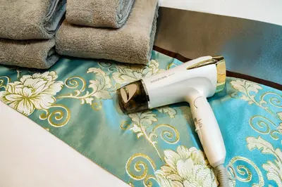 a hair dryer sitting on top of a table at 84-1, Shiomi 101, Entire room for rent, \u6f6e\u898bB101 in Tokyo