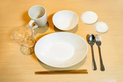 a table with a white plate and a cup and a spoon at 84-2, Shiomi 102, Entire room for rent, \u6f6e\u898bB102 in Tokyo