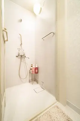 a shower stall in a white bathroom with a shower at 84-2, Shiomi 102, Entire room for rent, \u6f6e\u898bB102 in Tokyo