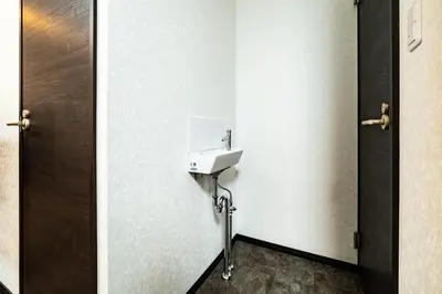 a bathroom with a sink and a door at 84-3, Shiomi 201, Entire room for rent, \u6f6e\u898bB201 in Tokyo