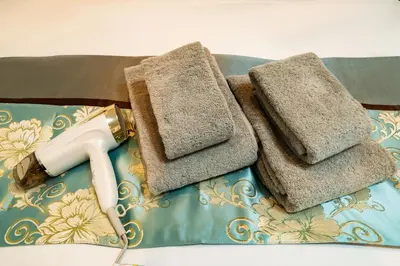 a pair of towels and a blow dryer on a table at 84-3, Shiomi 201, Entire room for rent, \u6f6e\u898bB201 in Tokyo