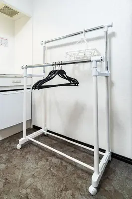 a towel rack in a kitchen next to a refrigerator at 84-3, Shiomi 201, Entire room for rent, \u6f6e\u898bB201 in Tokyo