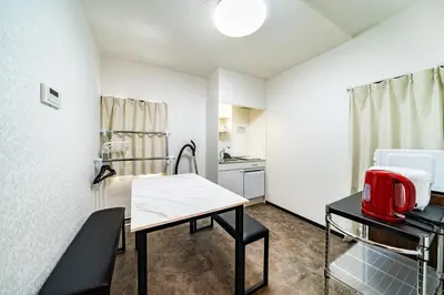 a small room with a table and a kitchen at 84-3, Shiomi 201, Entire room for rent, \u6f6e\u898bB201 in Tokyo