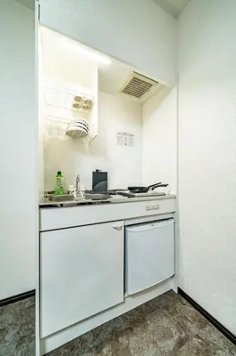 a kitchen with white cabinets and a sink at 84-4, Shiomi 202, Entire room for rent, \u6f6e\u898bB202 in Tokyo