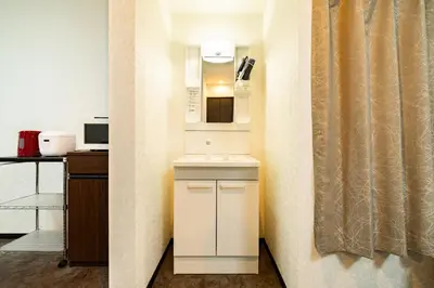 a small kitchen with a sink and a microwave at 84-4, Shiomi 202, Entire room for rent, \u6f6e\u898bB202 in Tokyo