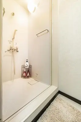 a shower in a bathroom with a glass door at 84-4, Shiomi 202, Entire room for rent, \u6f6e\u898bB202 in Tokyo