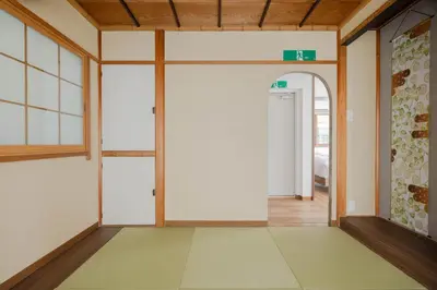 an empty room with a door leading to a bedroom at Fit-Inn\u7530\u539f\u753a in Tokyo