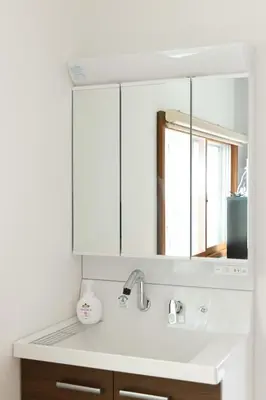 a bathroom with a sink and a mirror at Fit-Inn\u7530\u539f\u753a in Tokyo