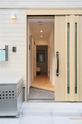 an open door into a hallway of a house at Urban House Hatagaya in Tokyo