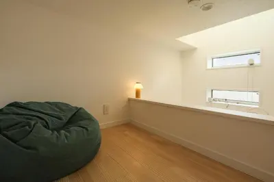 a living room with a bean bag chair and a sink at Urban House Hatagaya in Tokyo