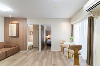 a living room with a couch and a table at Z7\u5168\u65b0\u88c5\u4fee\u5957\u623f3\u5ba42\u5385 \u65b0\u5bbf2\u7ad94\u5206\u949f,Max 8p-spacious,3rooms Near Shinjuku in Tokyo