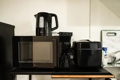 a coffee maker sitting on top of a microwave at 91, Honancho A, Entire house for rent, \u65b9\u5357\u753aA in Tokyo