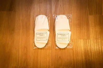 a pair of white shoes sitting on a wooden floor at 91, Honancho A, Entire house for rent, \u65b9\u5357\u753aA in Tokyo