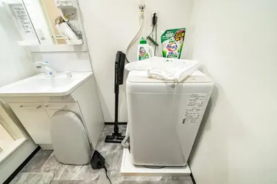 a bathroom with a washing machine and a sink at 91, Honancho A, Entire house for rent, \u65b9\u5357\u753aA in Tokyo