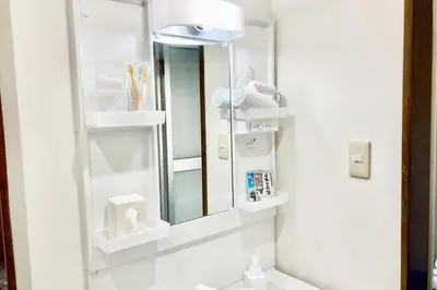 a bathroom with a mirror and a sink at Private Japanese garden,130m2, Ikebukuro Shinjuku Shibuya 5-15min , 200 restaurants nearby, 7-11 in front in Tokyo