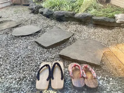 two pairs of flip flops sitting on the ground at Private Japanese garden,130m2, Ikebukuro Shinjuku Shibuya 5-15min , 200 restaurants nearby, 7-11 in front in Tokyo