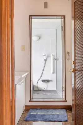 a bathroom with a shower with a mirror at Private Japanese garden,130m2, Ikebukuro Shinjuku Shibuya 5-15min , 200 restaurants nearby, 7-11 in front in Tokyo
