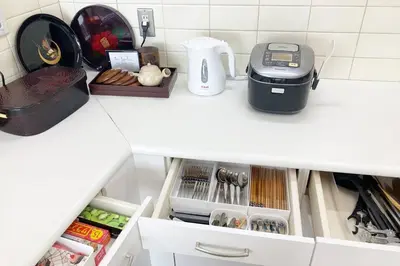 a kitchen counter with a drawer with food and a blender at Private Japanese garden,130m2, Ikebukuro Shinjuku Shibuya 5-15min , 200 restaurants nearby, 7-11 in front in Tokyo