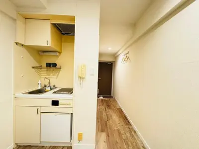 a kitchen with white cabinets and a sink in a room at kabukicho 910 SJ0275 in Tokyo