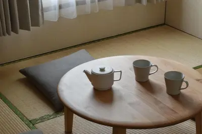 a wooden table with two cups on top of it at \u68ee\u4e0b\u5225\u90b8 in Tokyo